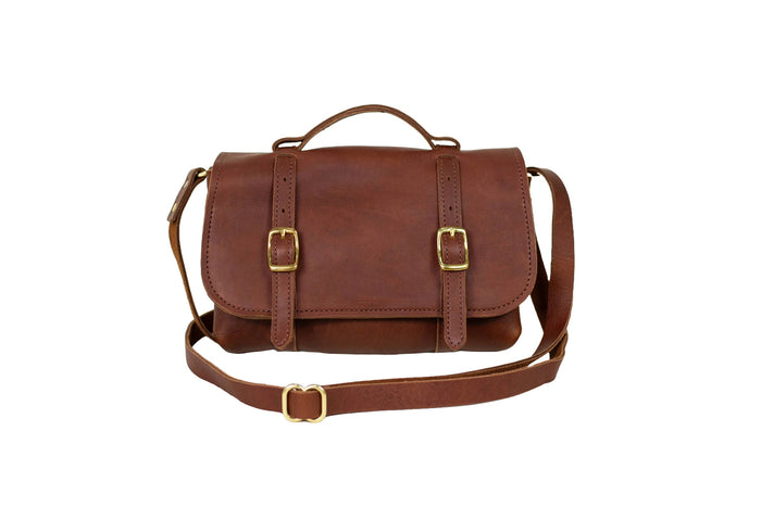 American-made cognac leather crossbody bag representing leather goods and accessories