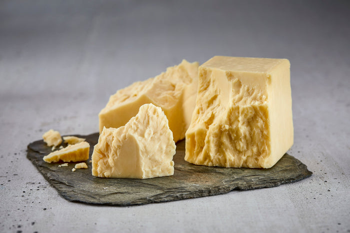 American-made aged cheddar cheese displayed in its product packaging