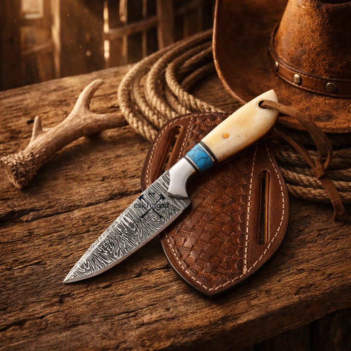 Damascus-style cowboy working knife with shaped bone handle and leather belt sheath