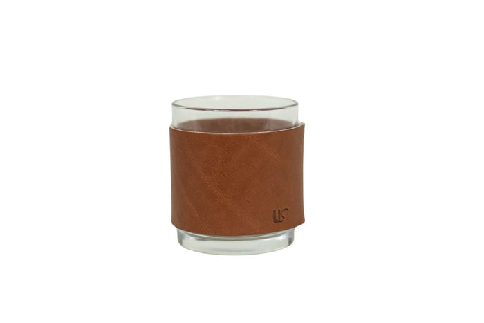 Leather-wrapped whiskey glass representing drinking glasses and barware