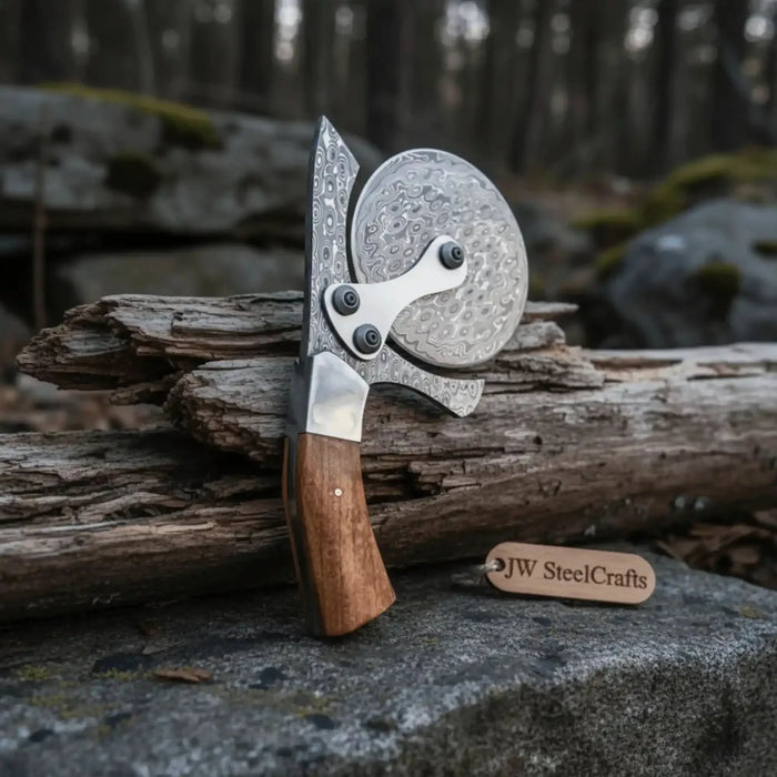 Round steel pizza cutter wheel with Damascus-style blade pattern and dark wooden handle