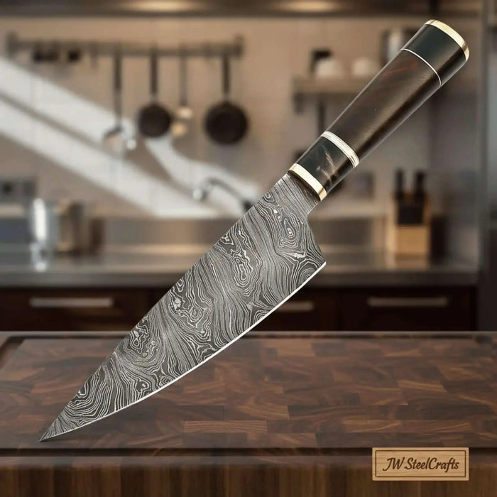 Gyuto-style chef knife with patterned steel blade and rosewood handle