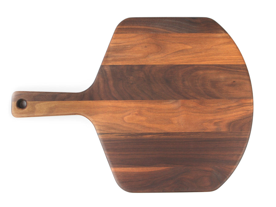 Overhead view of a walnut pizza peel with a long built-in handle