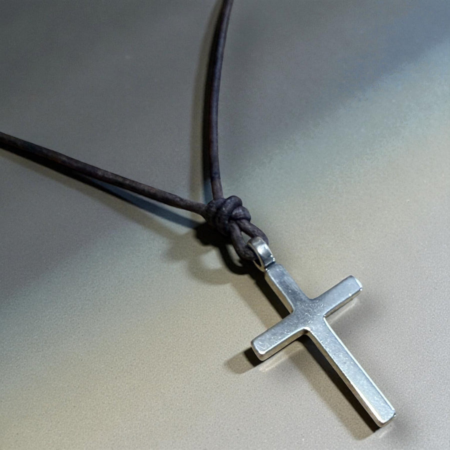 Close view of Classic Cross pendant and leather knot
