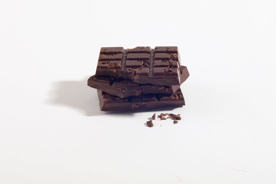 Stacked caramelized cocoa nib dark chocolate pieces