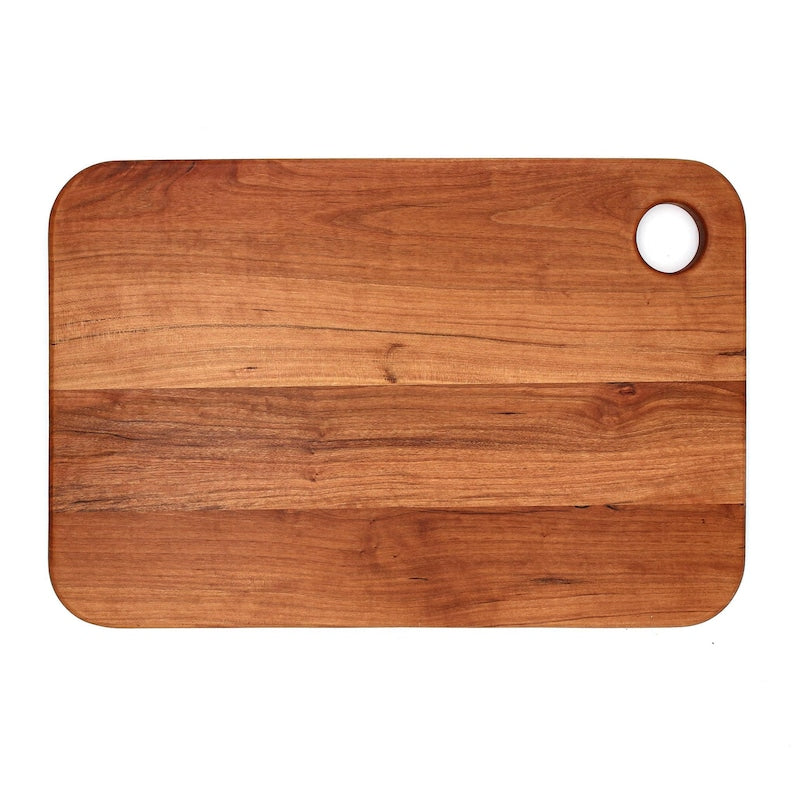 Round walnut paddle board with a built-in handle and hanging hole