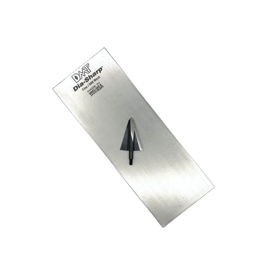 DMT Dia-Sharp diamond stone with a broadhead on its surface