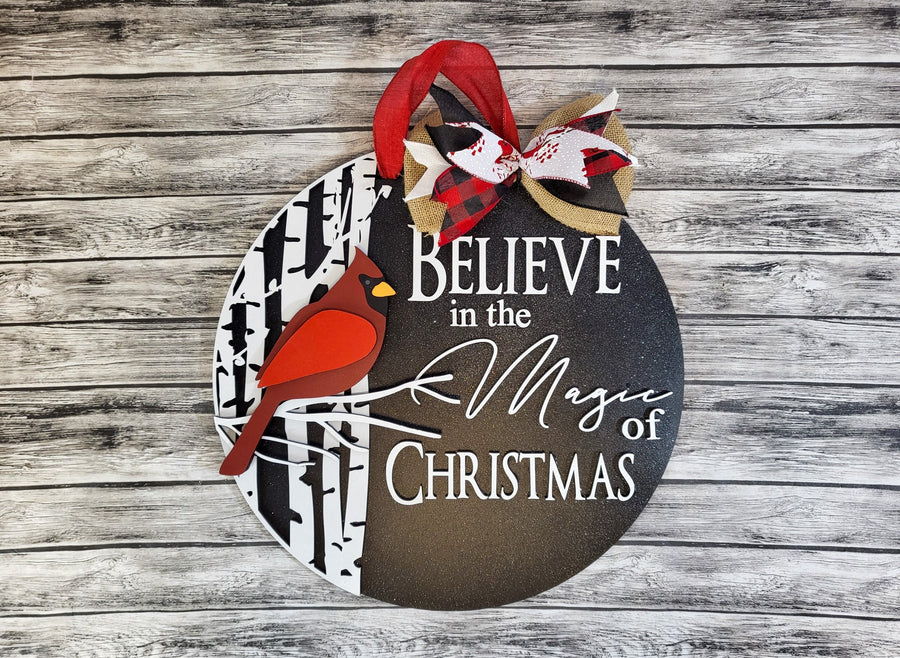 Painted cardinal sign example with a bow and red bird