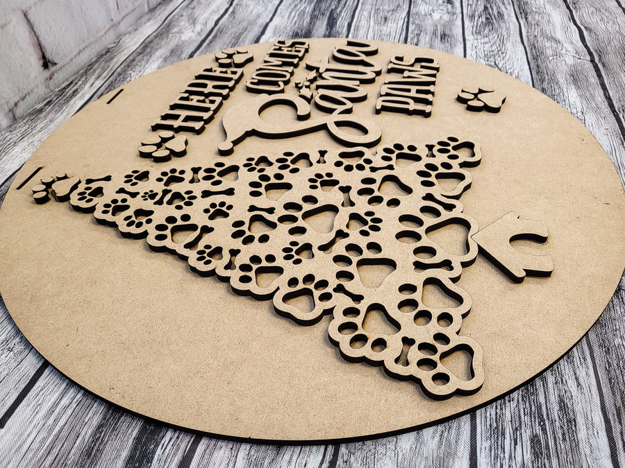 Separate Santa Paws lettering and paw shapes on the MDF backer