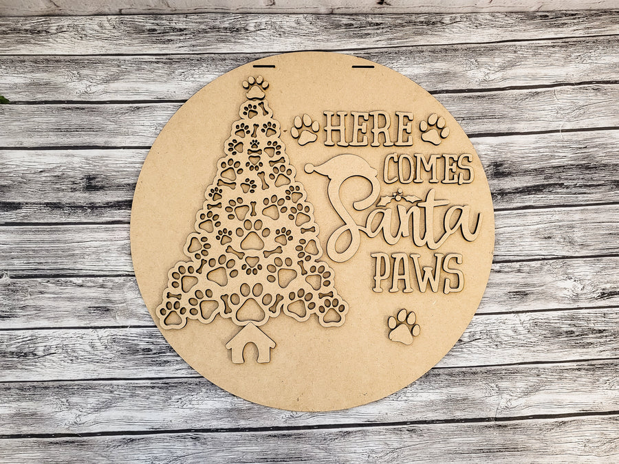 Unfinished Here Comes Santa Paws round sign with paw-pattern tree