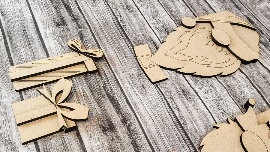 Close-up of unfinished winter gnome shapes and decorative accents