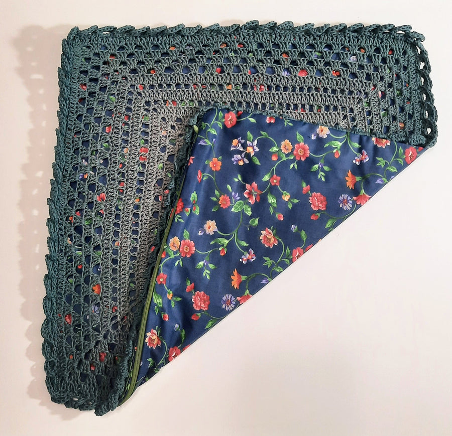 Green Gradient Crochet Pillow Cover, folded cover showing blue floral fabric