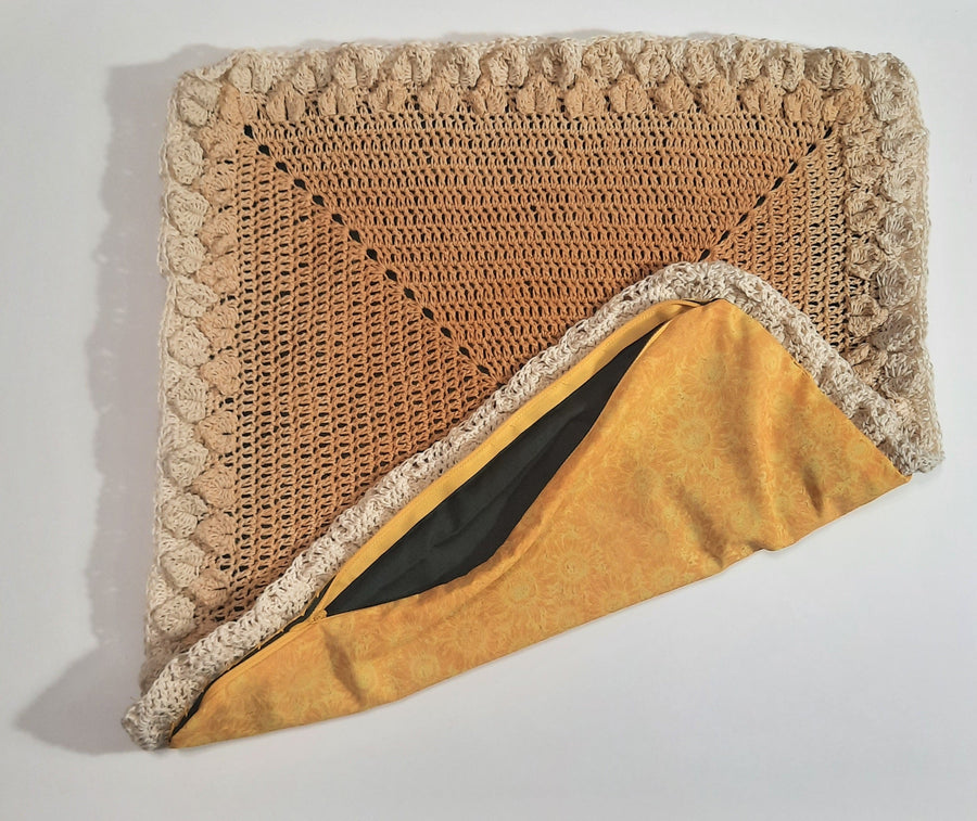 Brown & Yellow Crochet Pillow Cover, folded cover exposing fabric backing