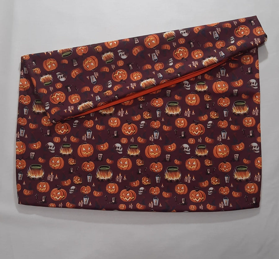 Halloween Pumpkin & Skull Pillow Cover, folded cover showing zippered opening