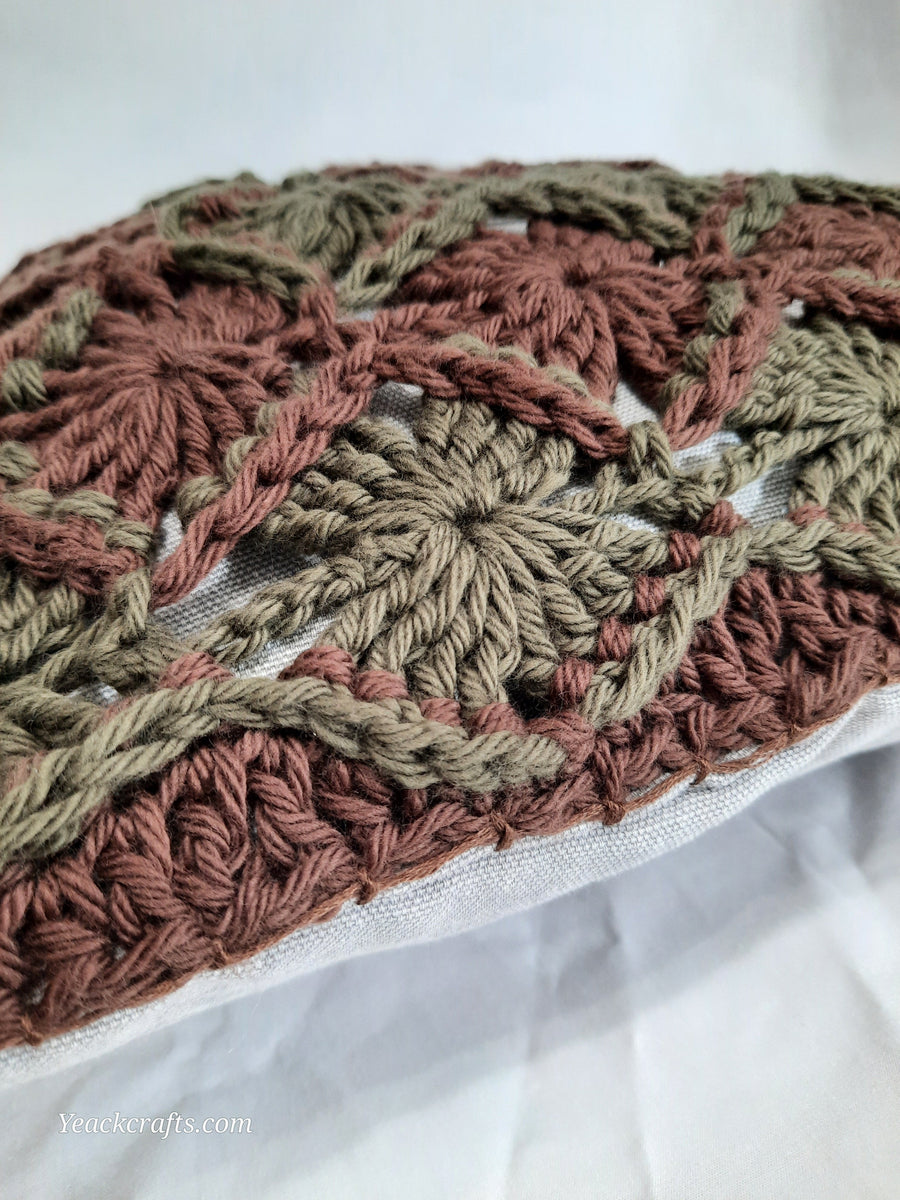 Brown & Green Crochet Pillow Cover, close-up of crochet on textured fabric