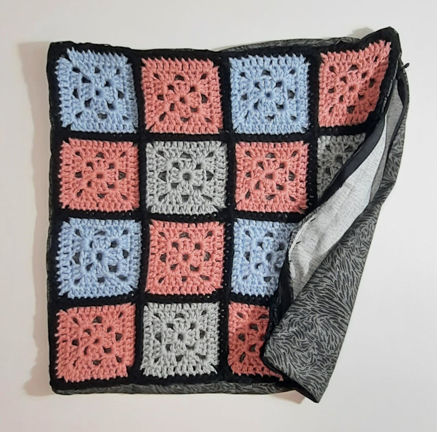 Pink Blue & Grey Crochet Pillow Cover, folded cover showing grey fabric reverse