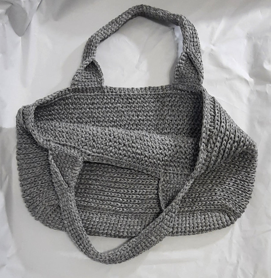 Light Grey Crochet Shopping Tote, bag with handles laid across the front