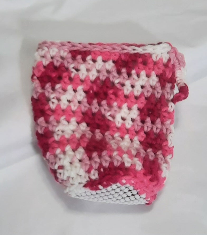 Pink & White Crochet Cup Cozy, angled view showing the underside and base