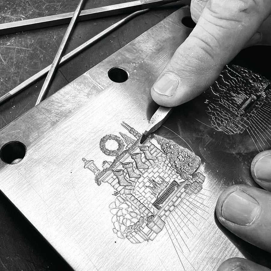 Artisan shaping and engraving metal with hand tools