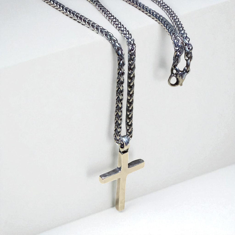 Classic Cross necklace and chain against white