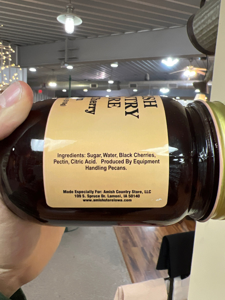 Black Cherry Jam package and ingredient label held in a hand