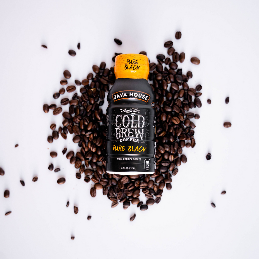 Pure Black bottle surrounded by coffee beans