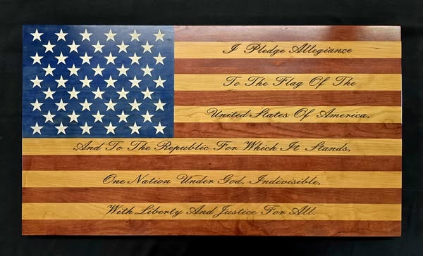 Pledge of Allegiance wooden flag with engraved lettering across the stripes