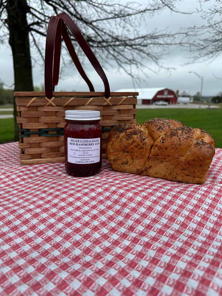 Miller’s Red Raspberry Jam 18 oz jar showing ingredients and Lamoni, Iowa production information.