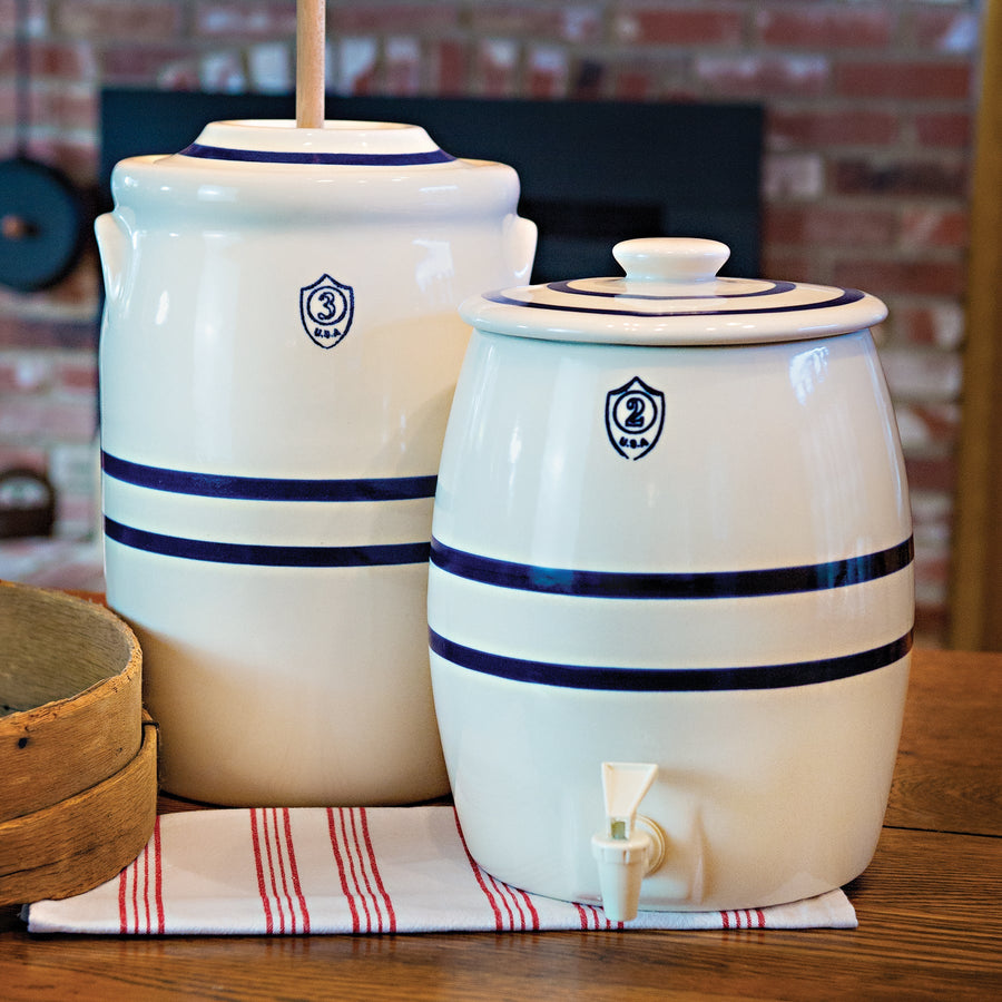 Blue-striped beverage keg and churn displayed together; tap and wooden dasher are separate