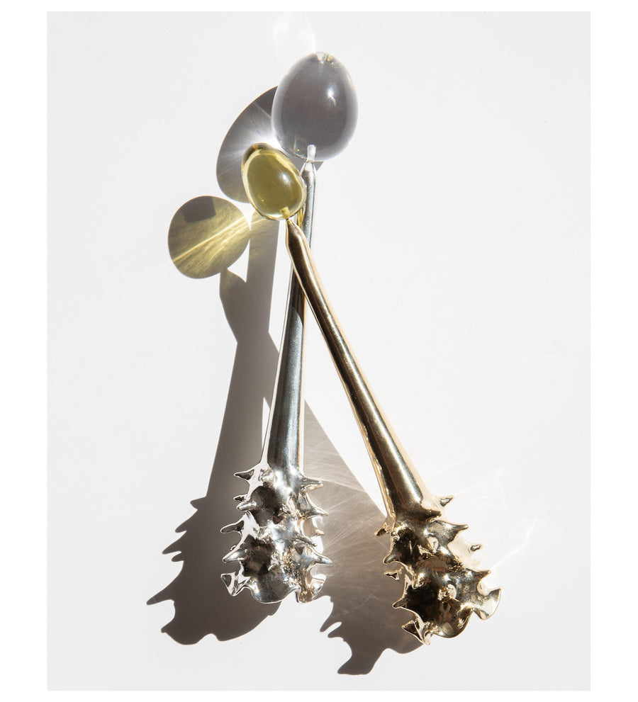 Brass and silver Oracle candle snuffers displayed together