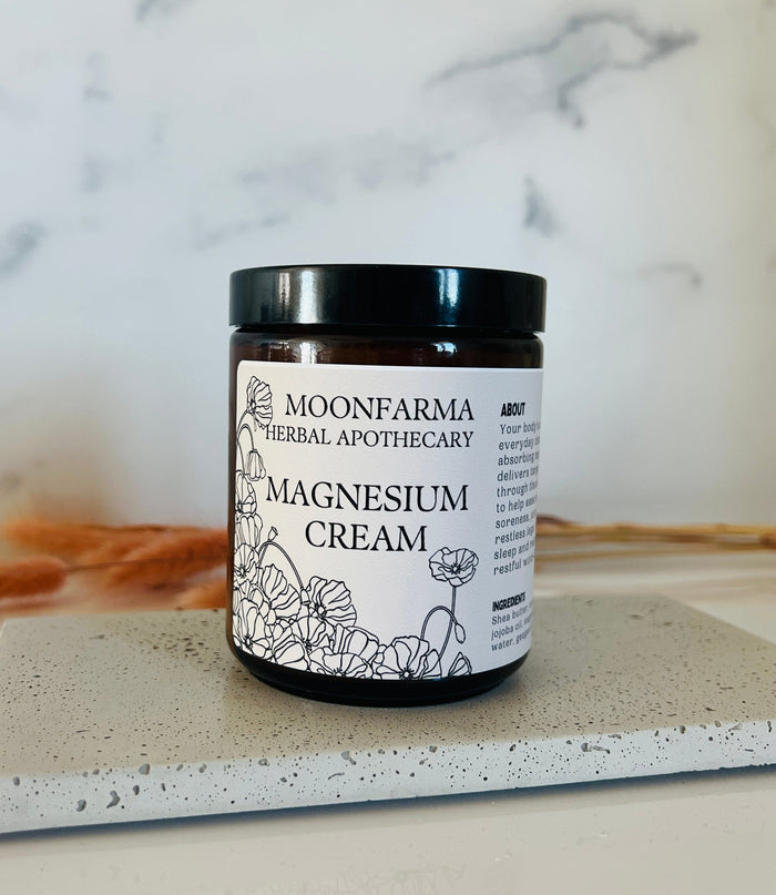 Black-lidded jar of magnesium body cream