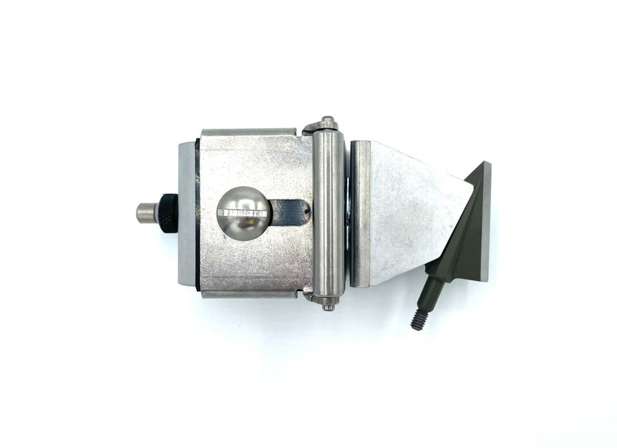 Compact broadhead held in a KME sharpener fitted with Delta Jaws
