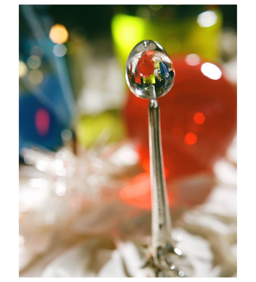 Close view of clear quartz handle with colorful reflections