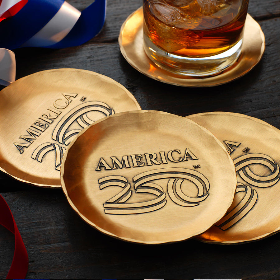 Styled display featuring America250 4-Piece Coaster Set with Caddy