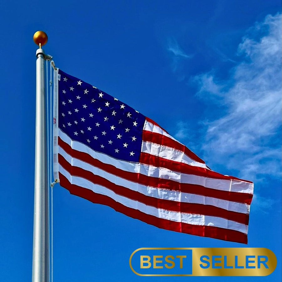 Nylon American flag flying from an outdoor flagpole against a blue sky