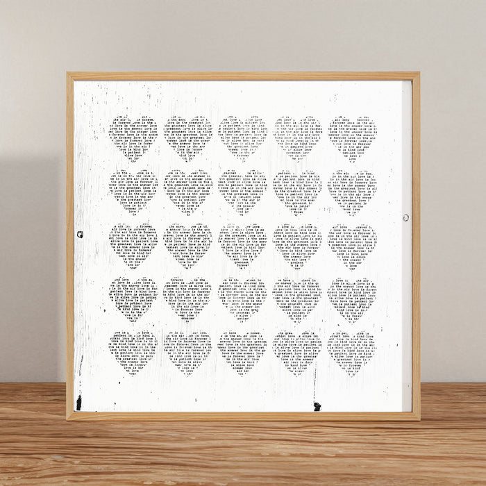 Love Is art print with a grid of text-filled hearts.