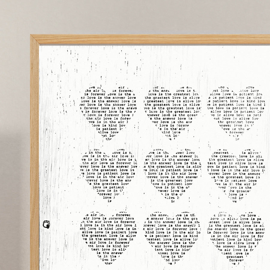 Love Is art print with a grid of text-filled hearts.
