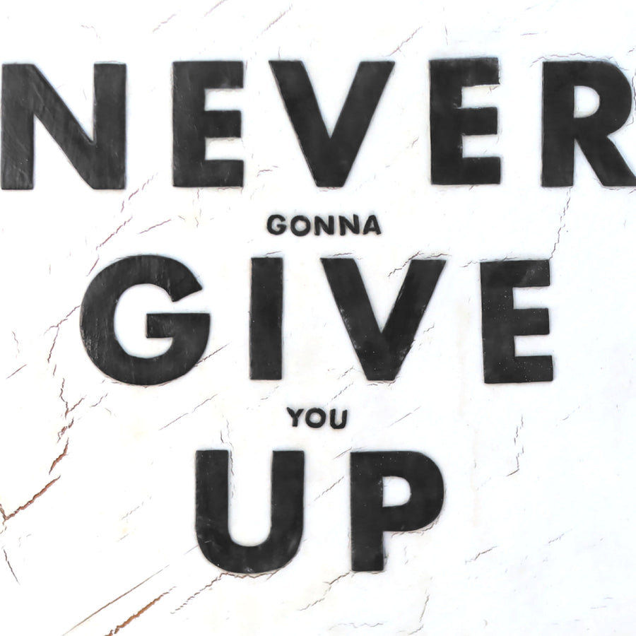 Never Give Up art print with bold distressed black lettering.