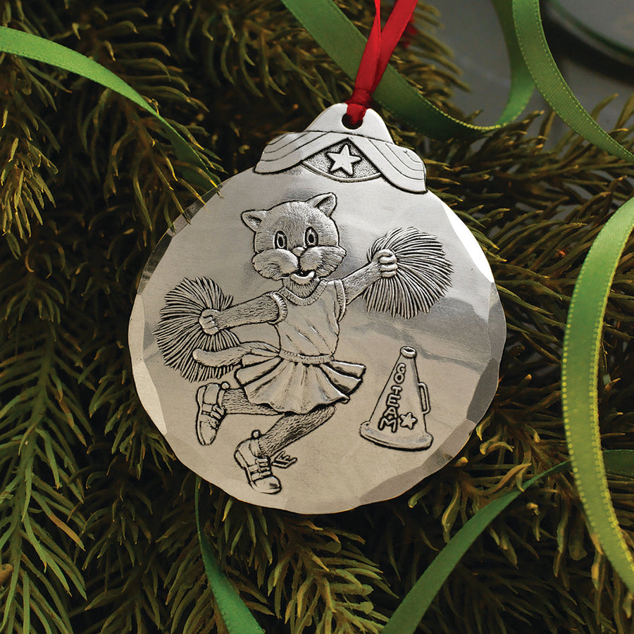 Styled display featuring Cheerleader Cat Ornament