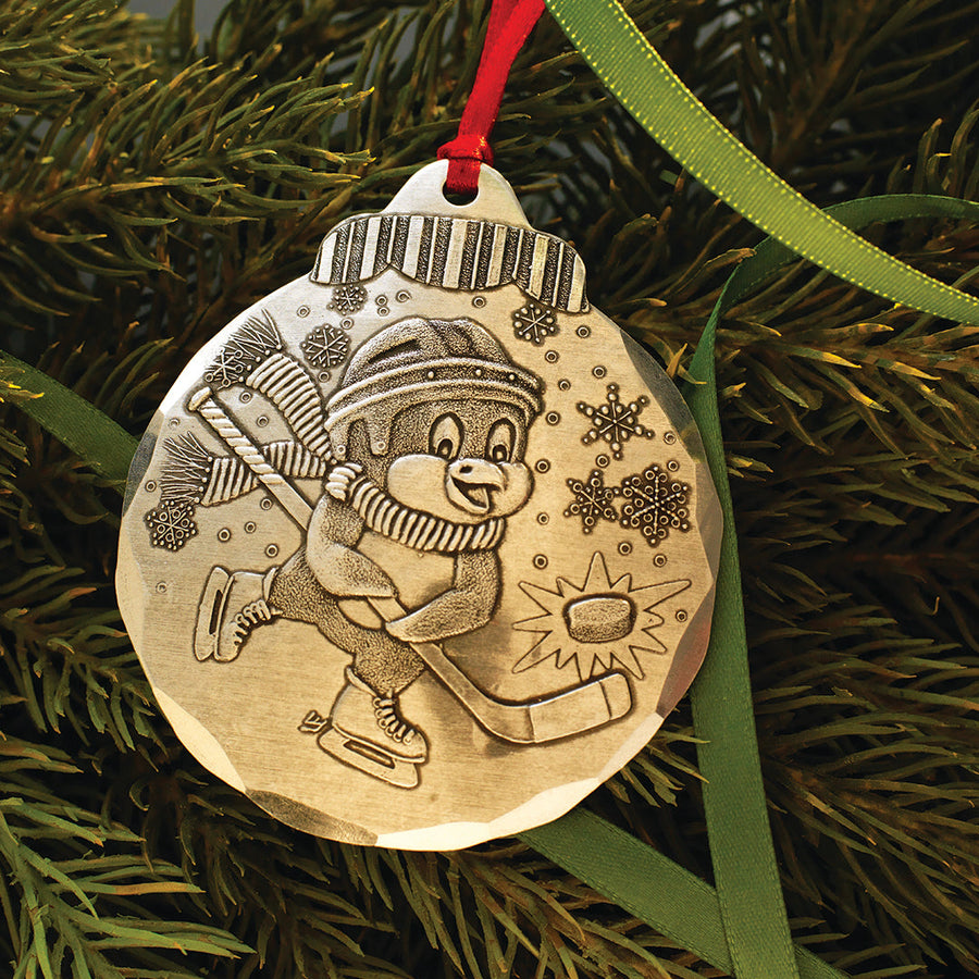 Styled display featuring Hockey Penguin Ornament