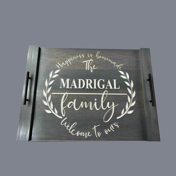 Engraved decorative stove cover with handles and family wording