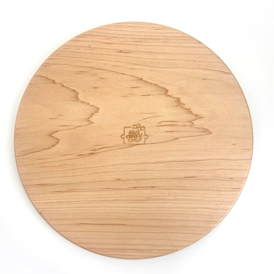 Reverse side of a wooden serving board showing natural wood grain