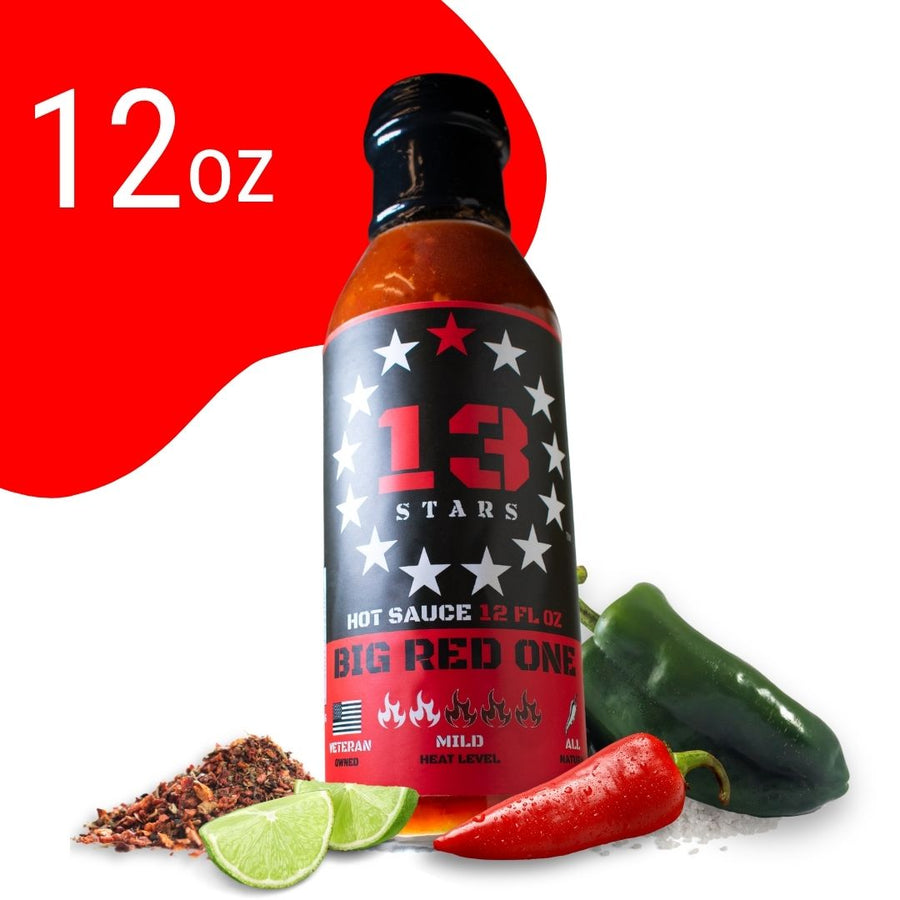 Big Red One 12 oz hot sauce bottle with peppers and lime