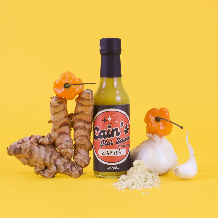 Caribbean-style Scotch bonnet hot sauce bottle with mustard and turmeric ingredients