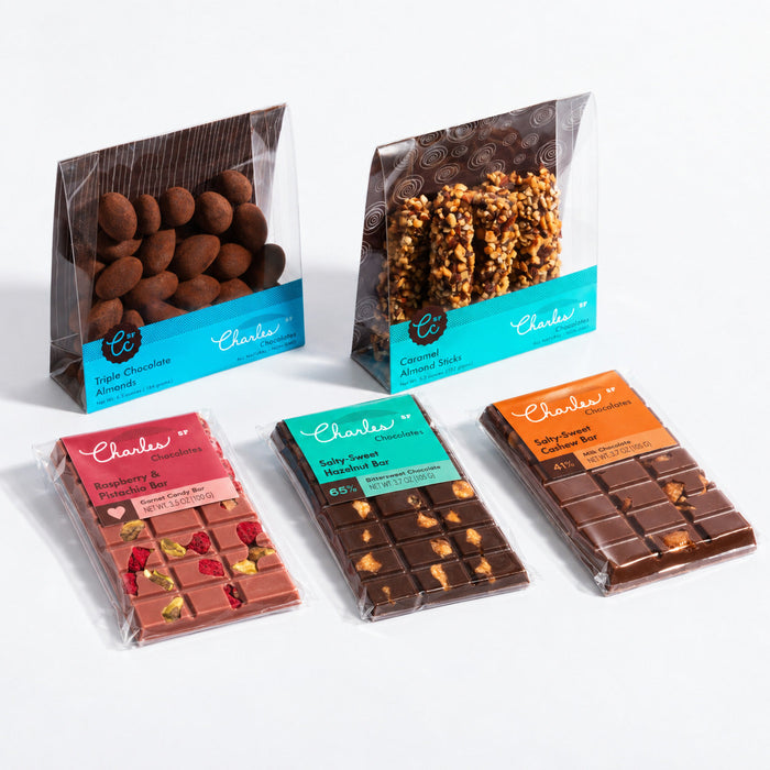 Medium artisan gift assortment with coated almonds, caramel sticks, and three chocolate bars