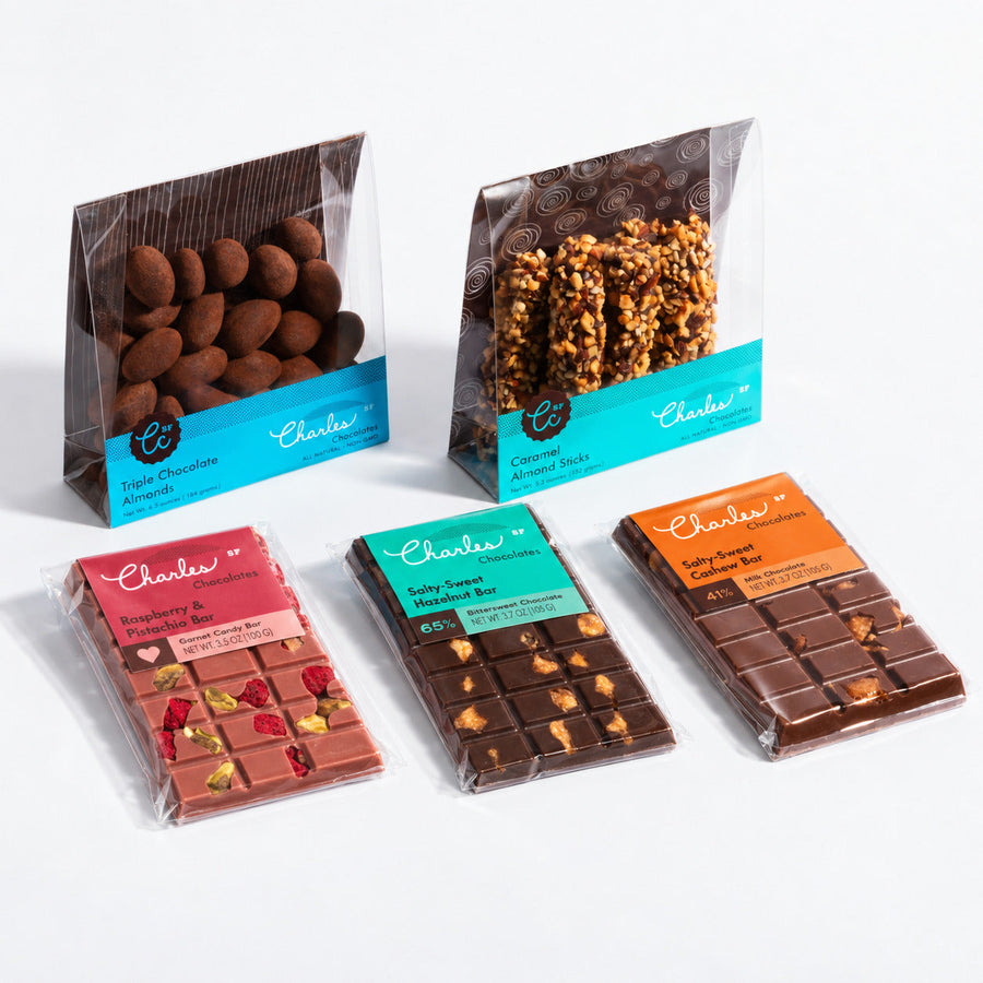 Medium artisan gift assortment with coated almonds, caramel sticks, and three chocolate bars