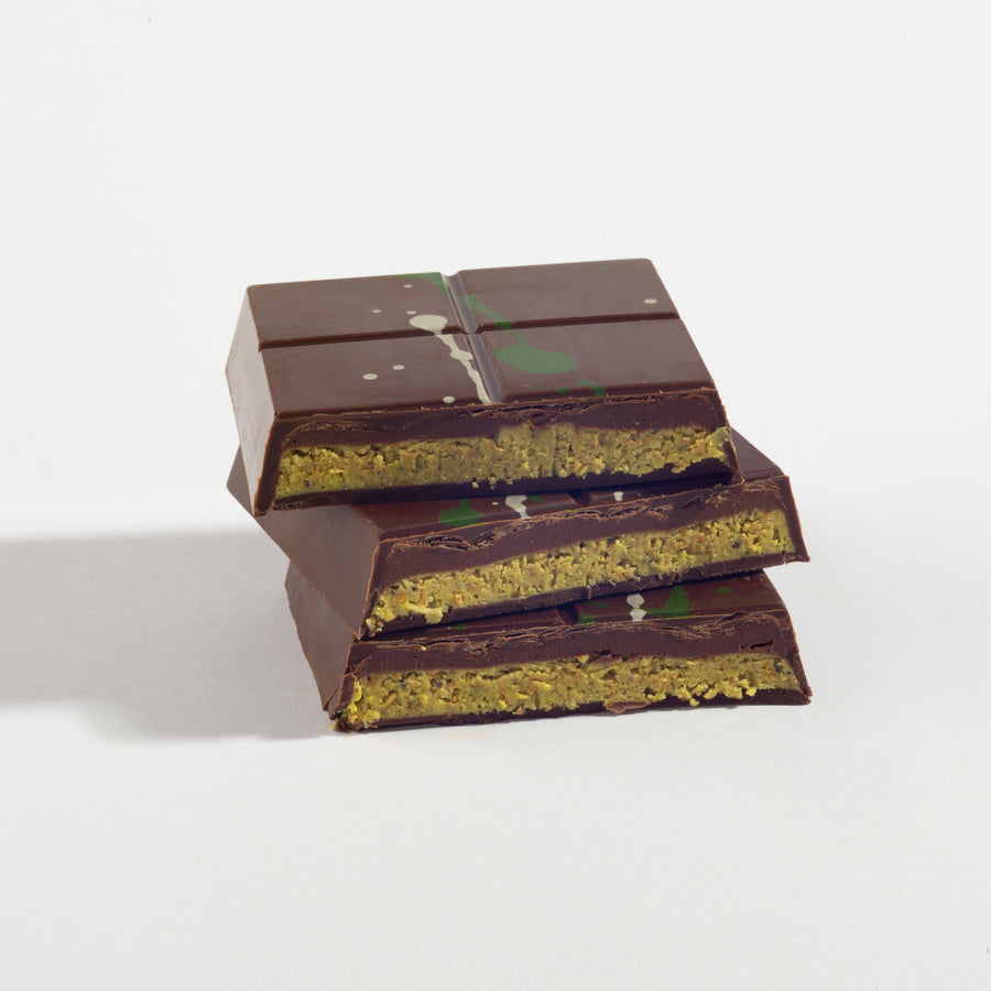 Dark Ganache Dubai Pistachio Chocolate Bar cut open to show its layered filling