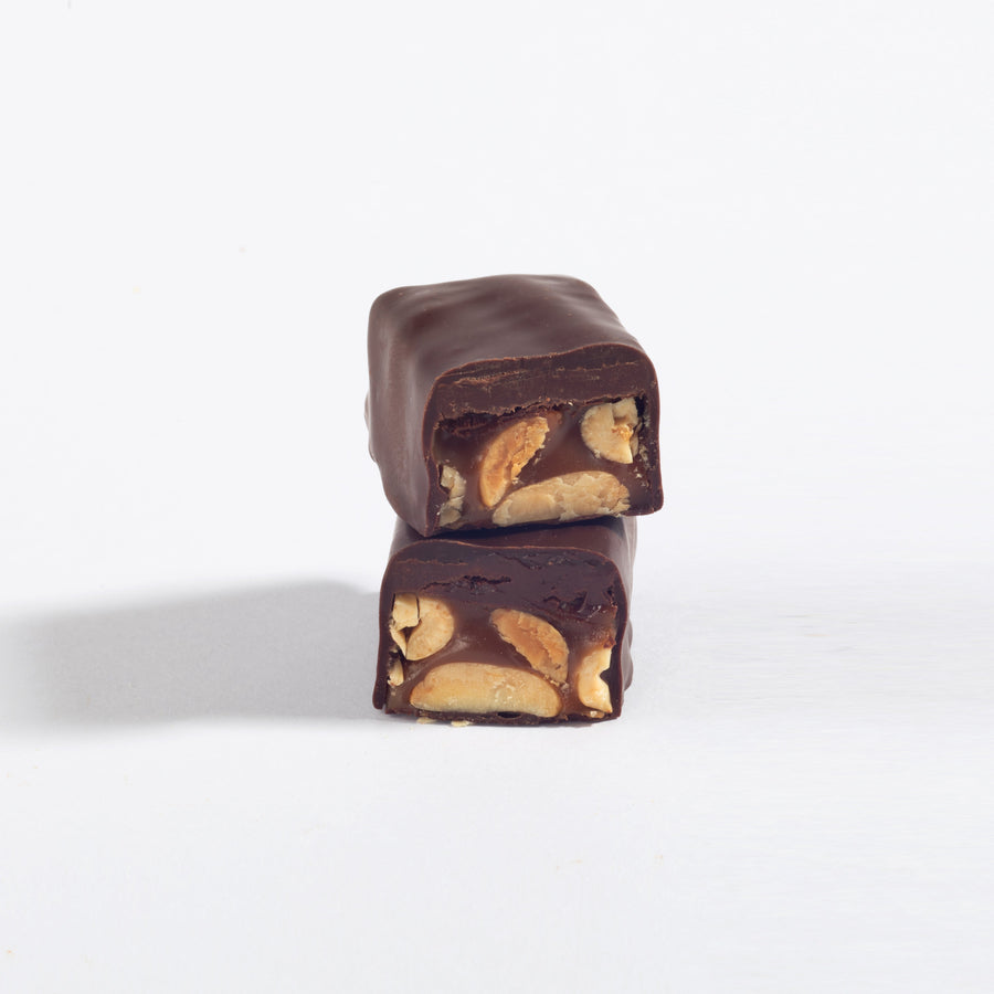 Stacked pieces of Ode To Joy Almond Caramel & Chocolate Ganache Bar