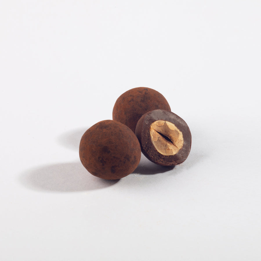 Triple Chocolate Oregon Hazelnuts, whole and halved to show the nut center