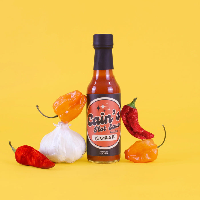 Ghost pepper and habanero hot sauce bottle with product ingredient label